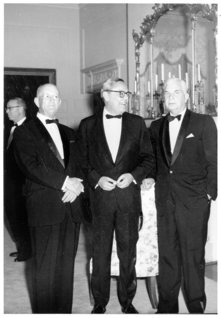 Black and white photograph of three men in formal attire.