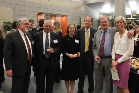Photo of 4 men and 2 women at a reception. 